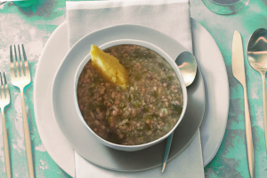 Traditional Aruban soppi yambo bowl featuring okra and fish soup, a must-try dish showcasing local flavors.