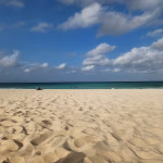 Beach view comparing Palm Beach high-rise hotels and Eagle Beach low-rise resorts in Aruba