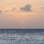 Calm sea at sunset seen from the beach in Aruba