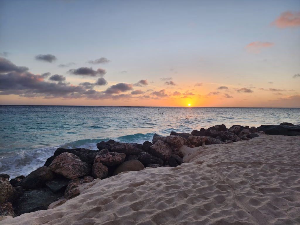 Calm turquoise water and empty beach in Aruba during low season